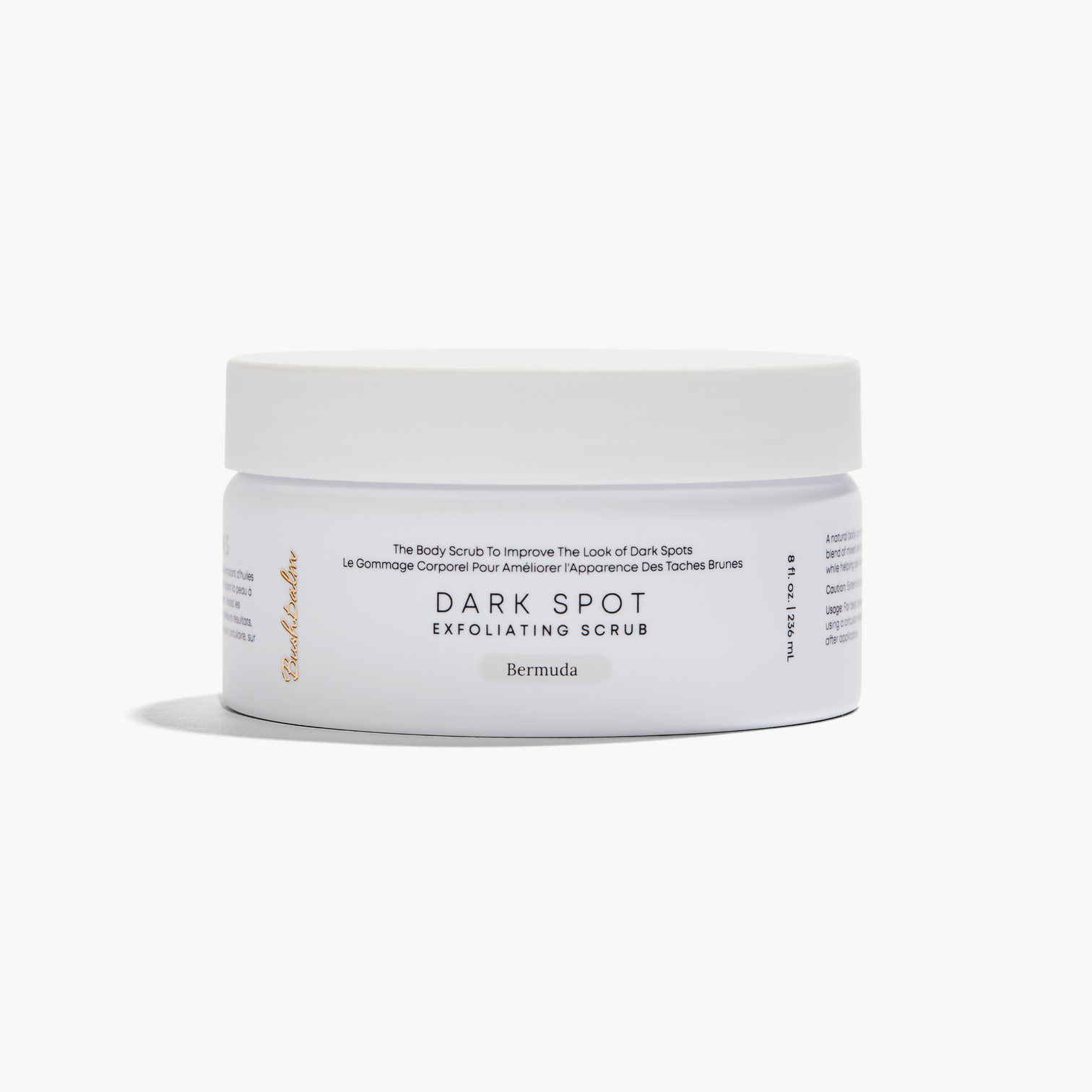 Container of dark spot exfoliating scrub on a white background.