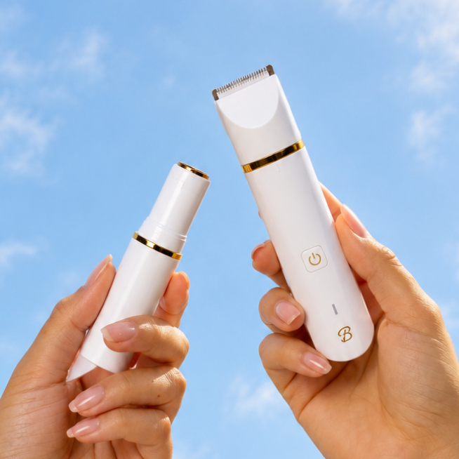 Two hands holding the Francesca bikini trimmer against a blue sky